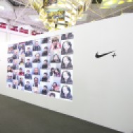 Runners view their image from the NIKE photo booth sharing why they run.